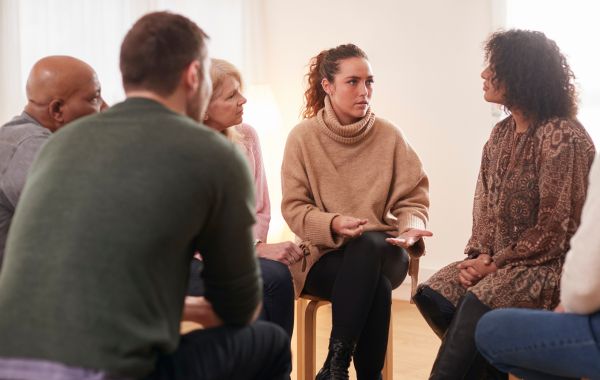 Six people participating in group therapy.